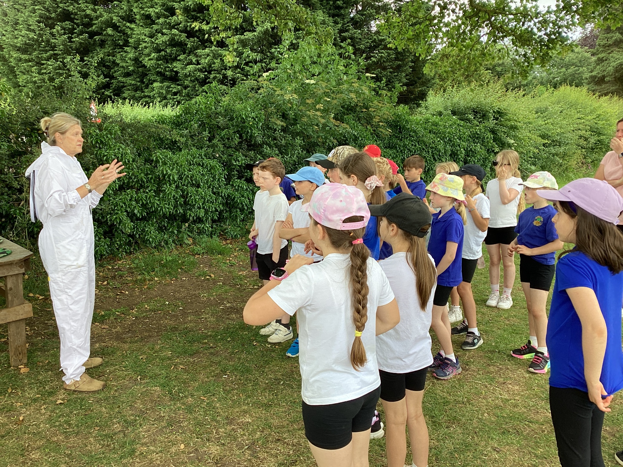 Beekeeper explaining to KS2 children